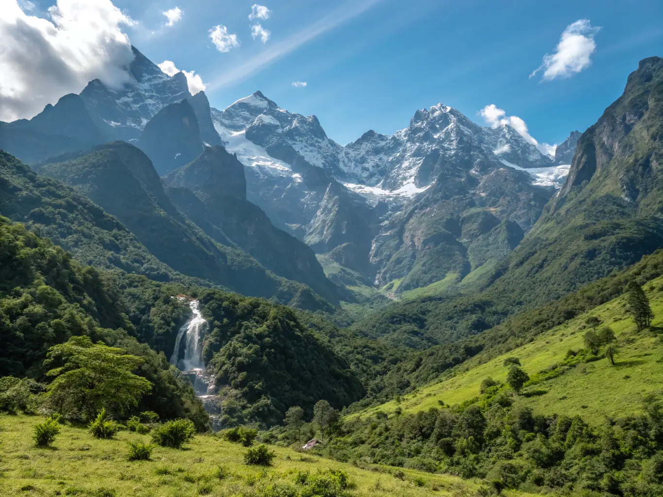 A scenic shot of tourists trekking through the Rwenzori Mountains, with lush greenery and mist-covered peaks in the background.